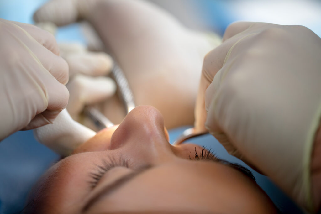 oral surgery being performed on a patient