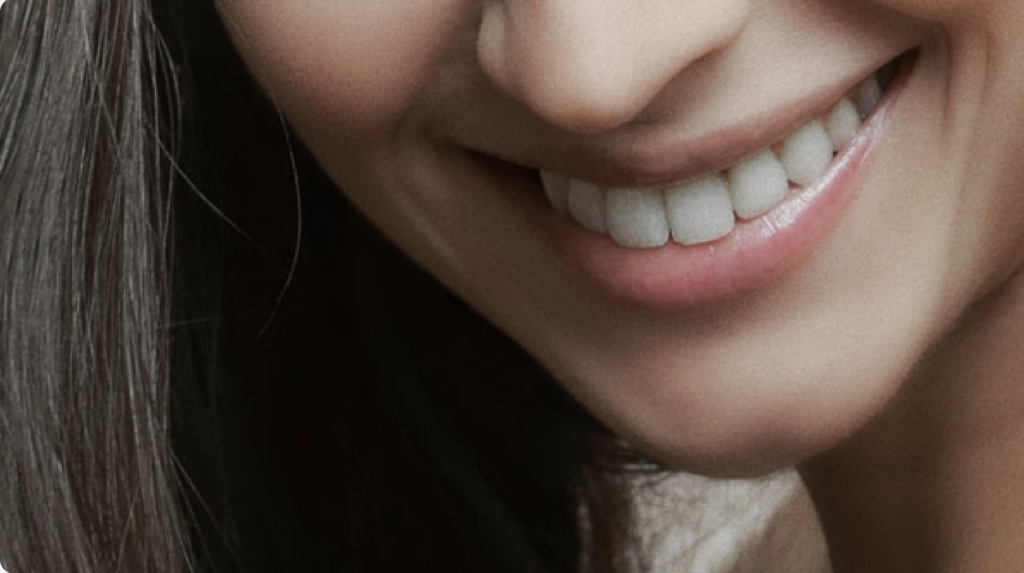 close up of a woman's smiling mouth with beautiful teeth